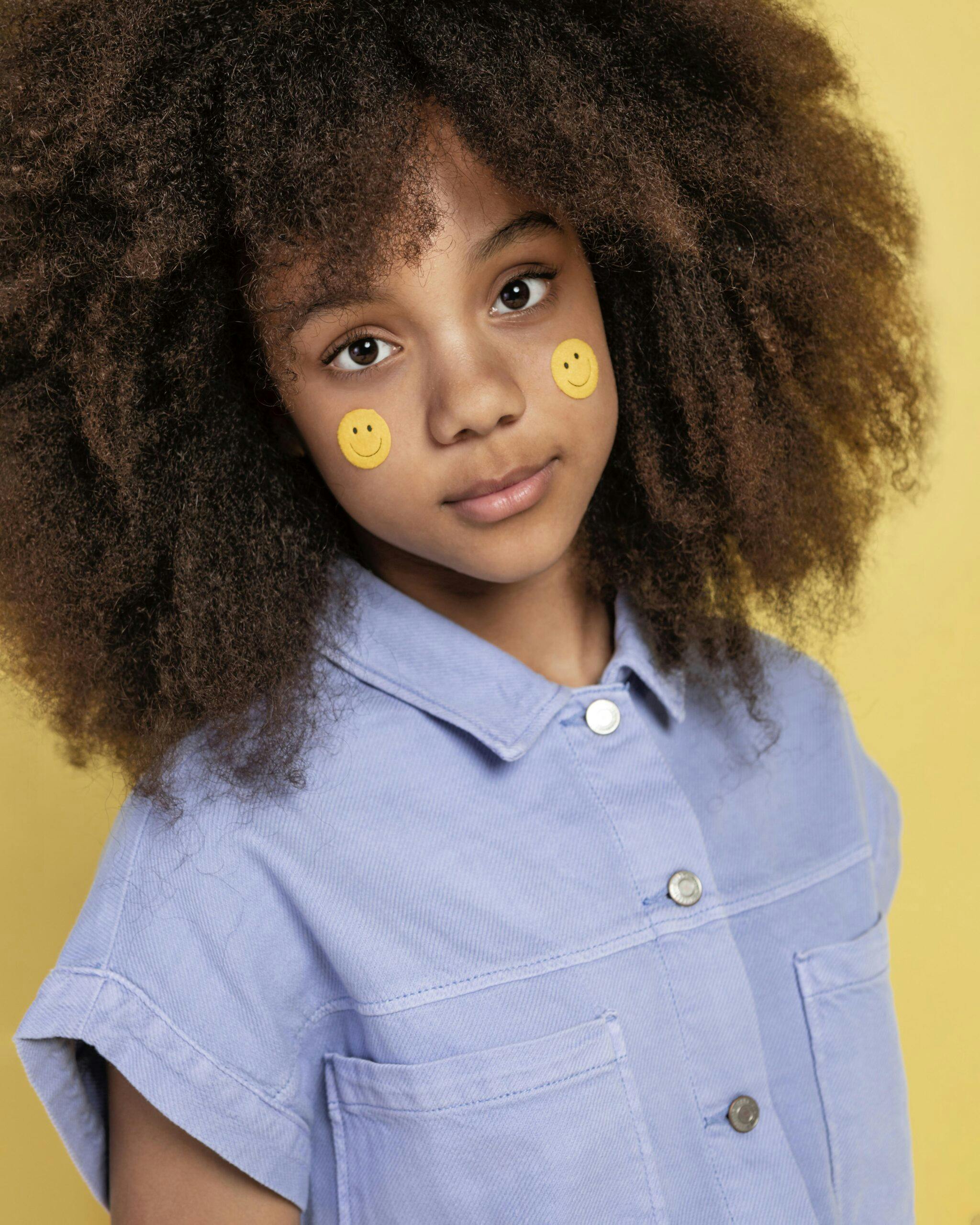 portrait-young-adorable-girl-posing-with-emoji-stickers-her-face